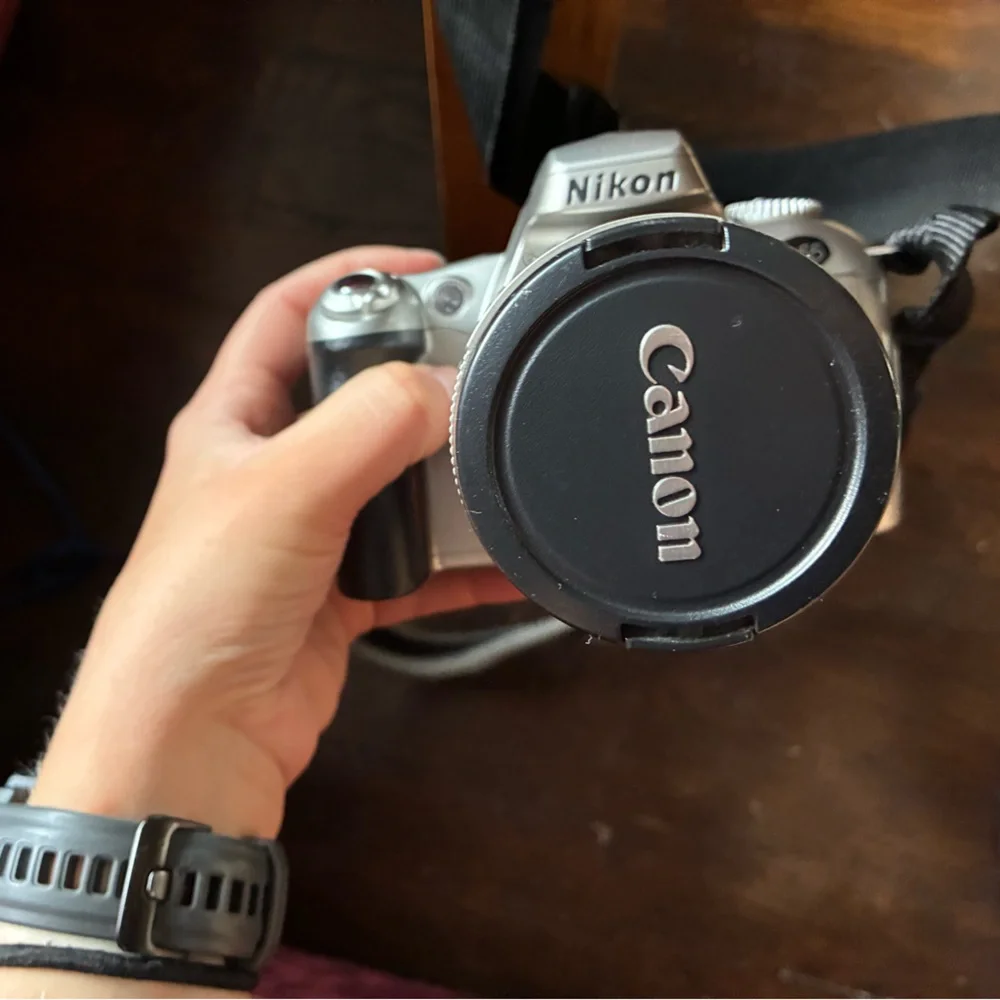 Nikon Gray Camera with Canon Lens and Lowepro Camera Case